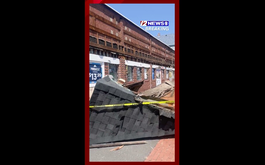 WATCH: Awning collapses at New Bedford liquor store