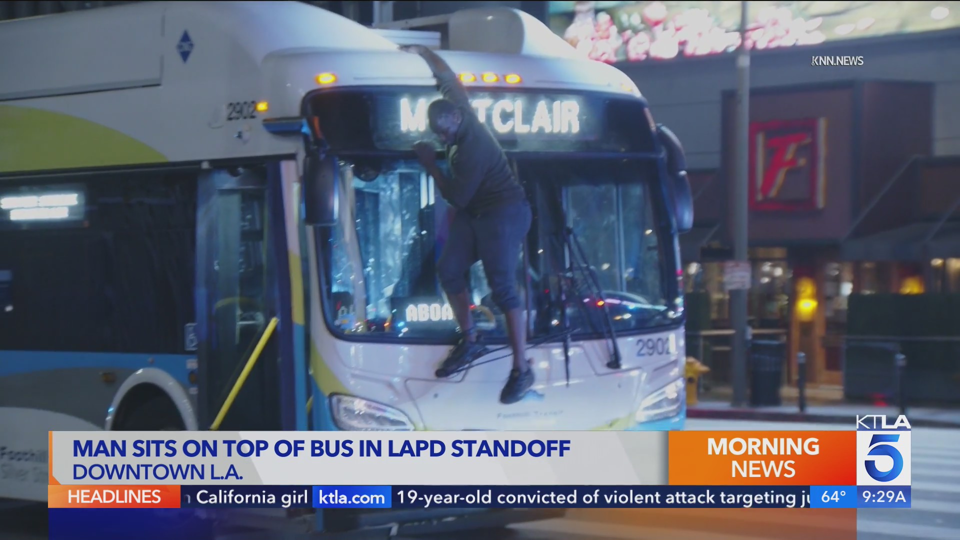 Man sits on top of bus during standoff with police in downtown L.A. – KTLA